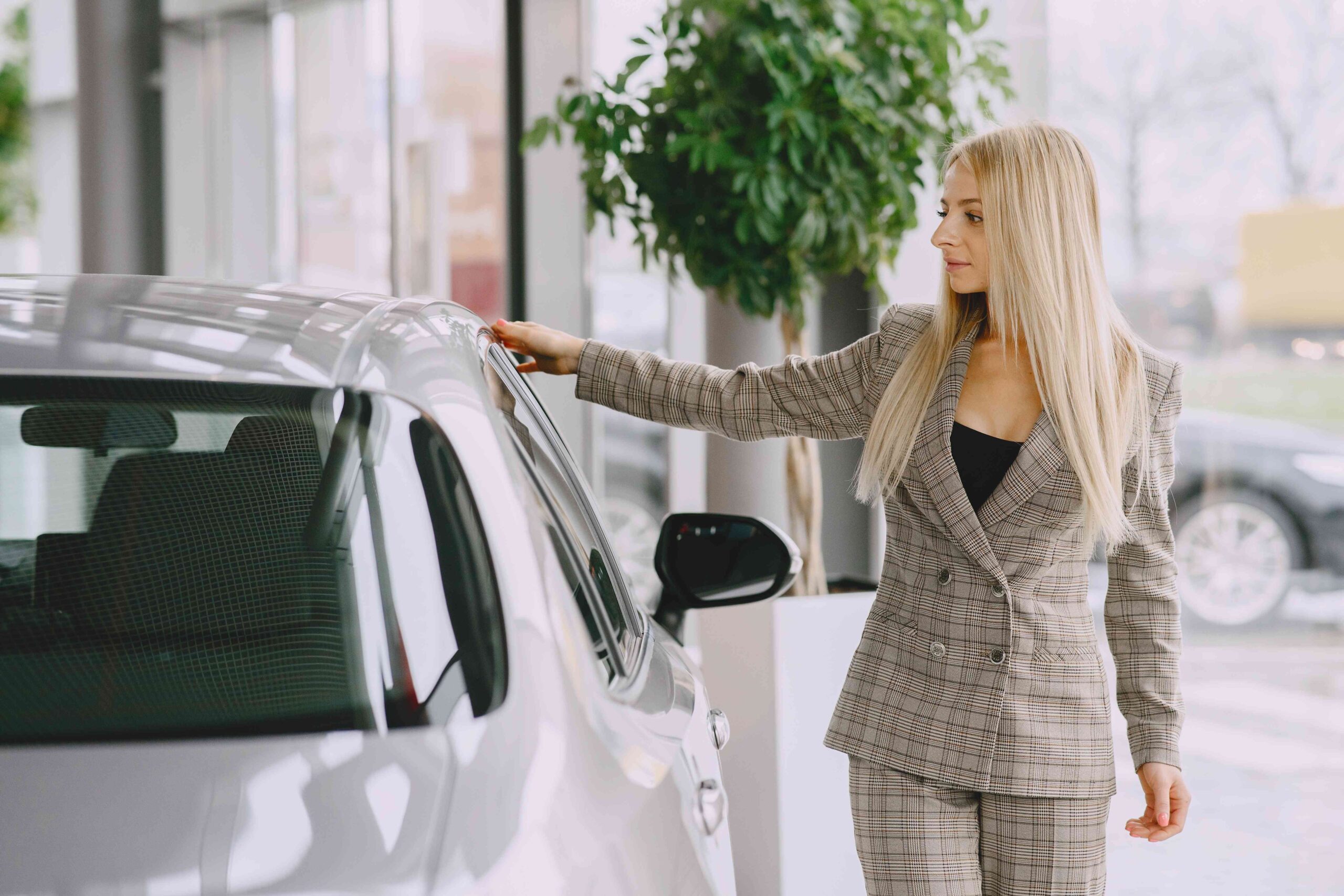 lady-car-salon-woman-buying-car-elegant-woman-brown-suit_11zon